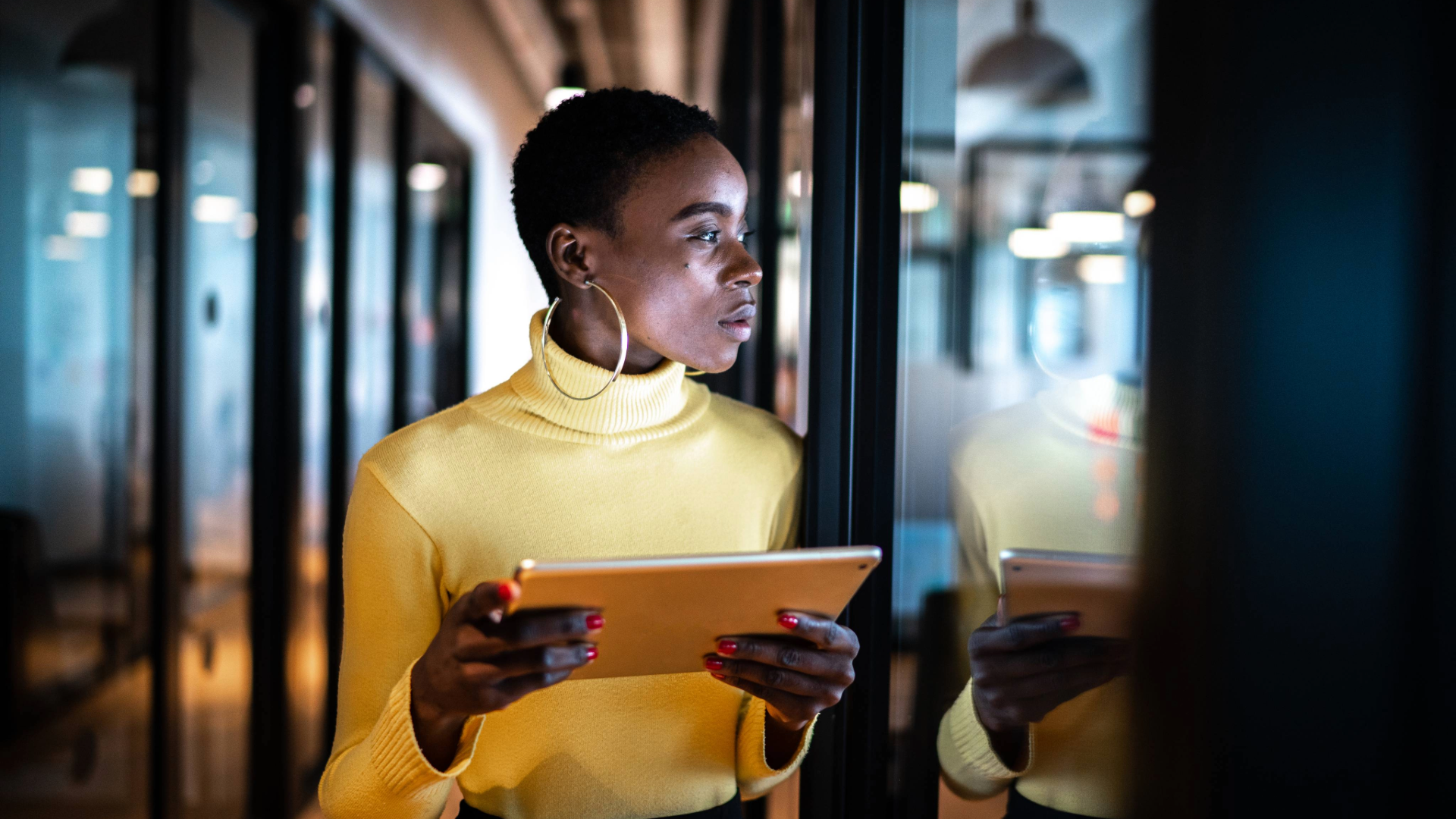 black woman holding a Tablet